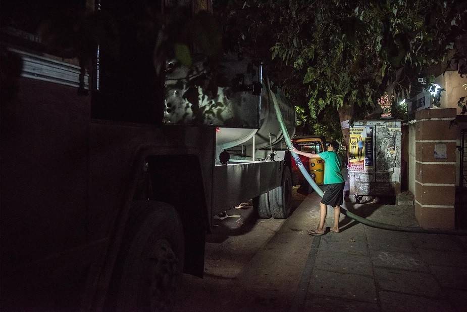 Water is distributed throughout the day till midnight. The demand is at a pace that to supply water to most parts of the city once in 2 days, the metro water stations work throughout the day and night. Photo by: Steevez Rodriguez/PEP Collective.